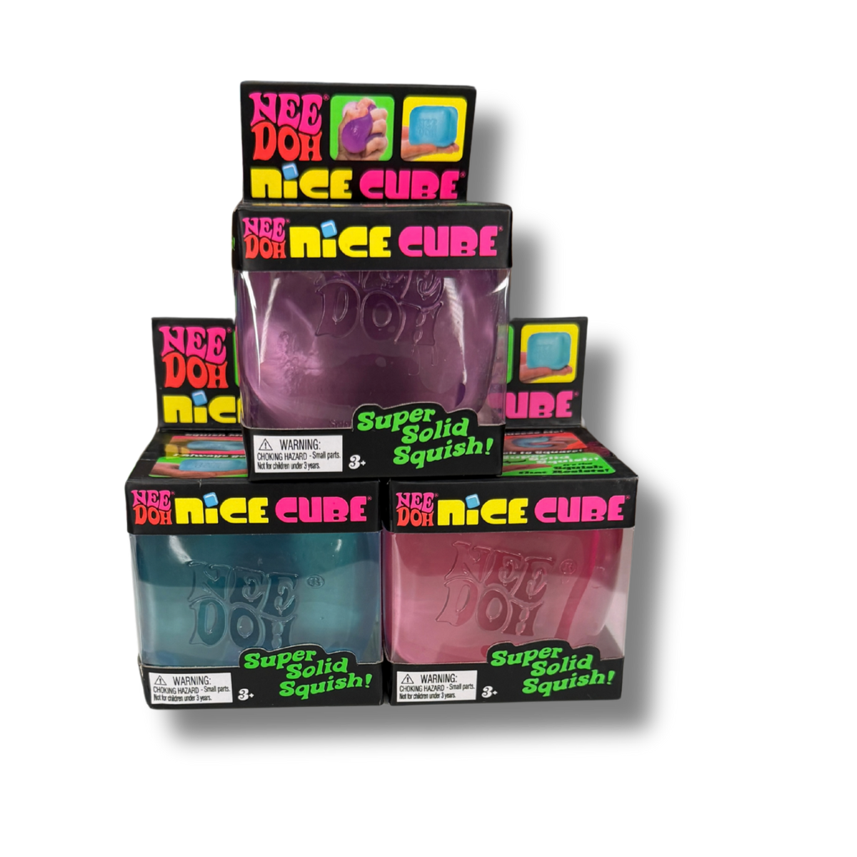 Four boxed Nee Doh Nice Cube squishy toys arranged in a pyramid stack on a white background. The packages show different colors: purple, blue, pink, and a darker purple, with colorful branding and text including 'Nee Doh Nice Cube' and 'Super Solid Squishy!'.