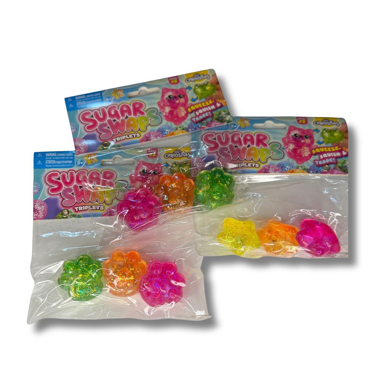 Three packages of Sugar Swirl Triple Yummy Gummy Tabs by Candy Crush, containing colorful translucent gummy candies in pink, green, and orange, displayed on a white background.