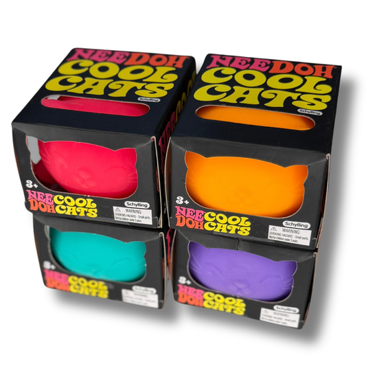 Four boxes of Needo Cool Cats finger puppets arranged in a 2x2 grid. The packaging is black with bold yellow and red lettering, and each box features a die-cut window showing a different puppet color: pink, orange, teal, and purple.
