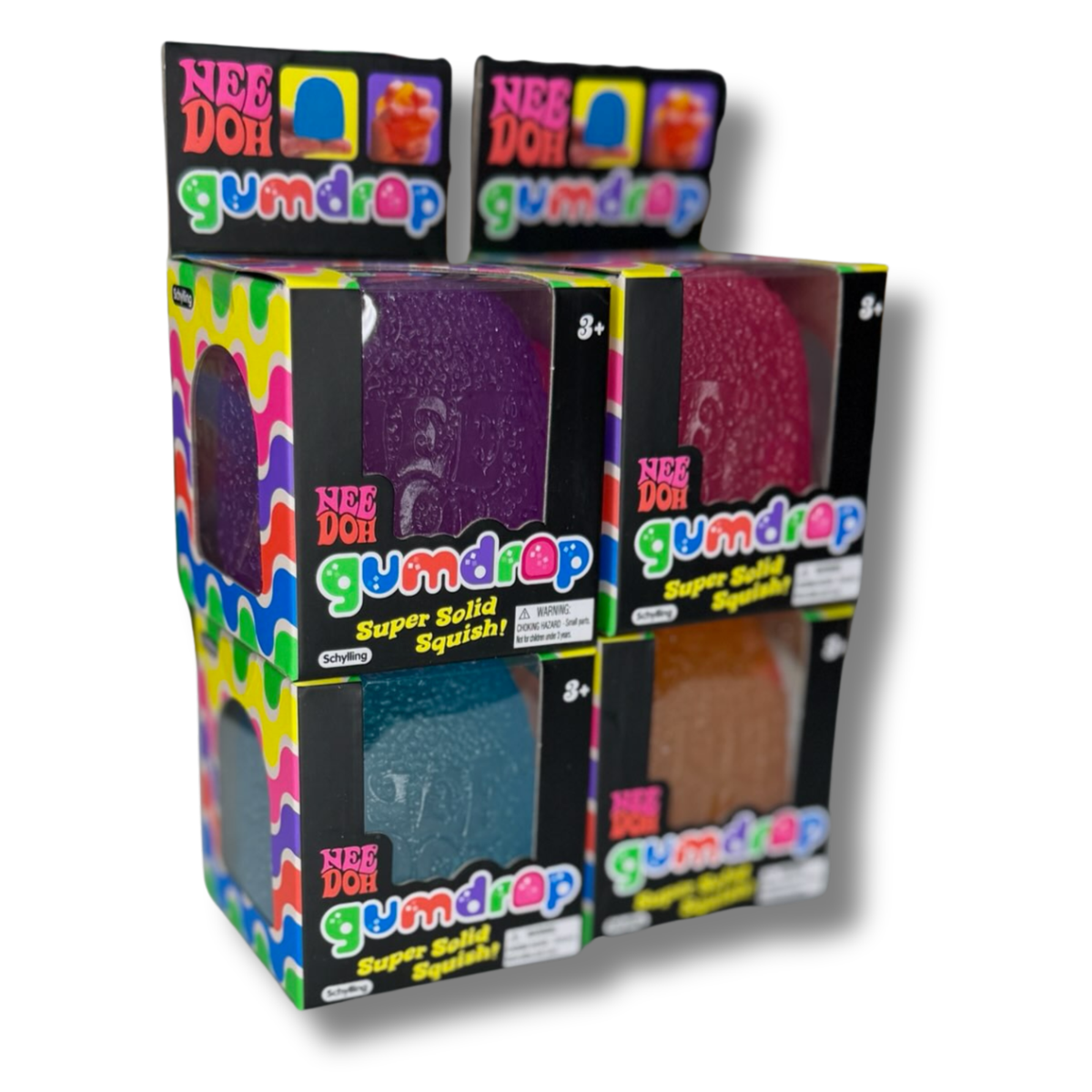 A retail display box of Nee Doh Gumdrop Super Solid Squishies, showing four different colored gummy eggs (purple, pink, blue, and brown) in clear plastic windows with colorful branding.