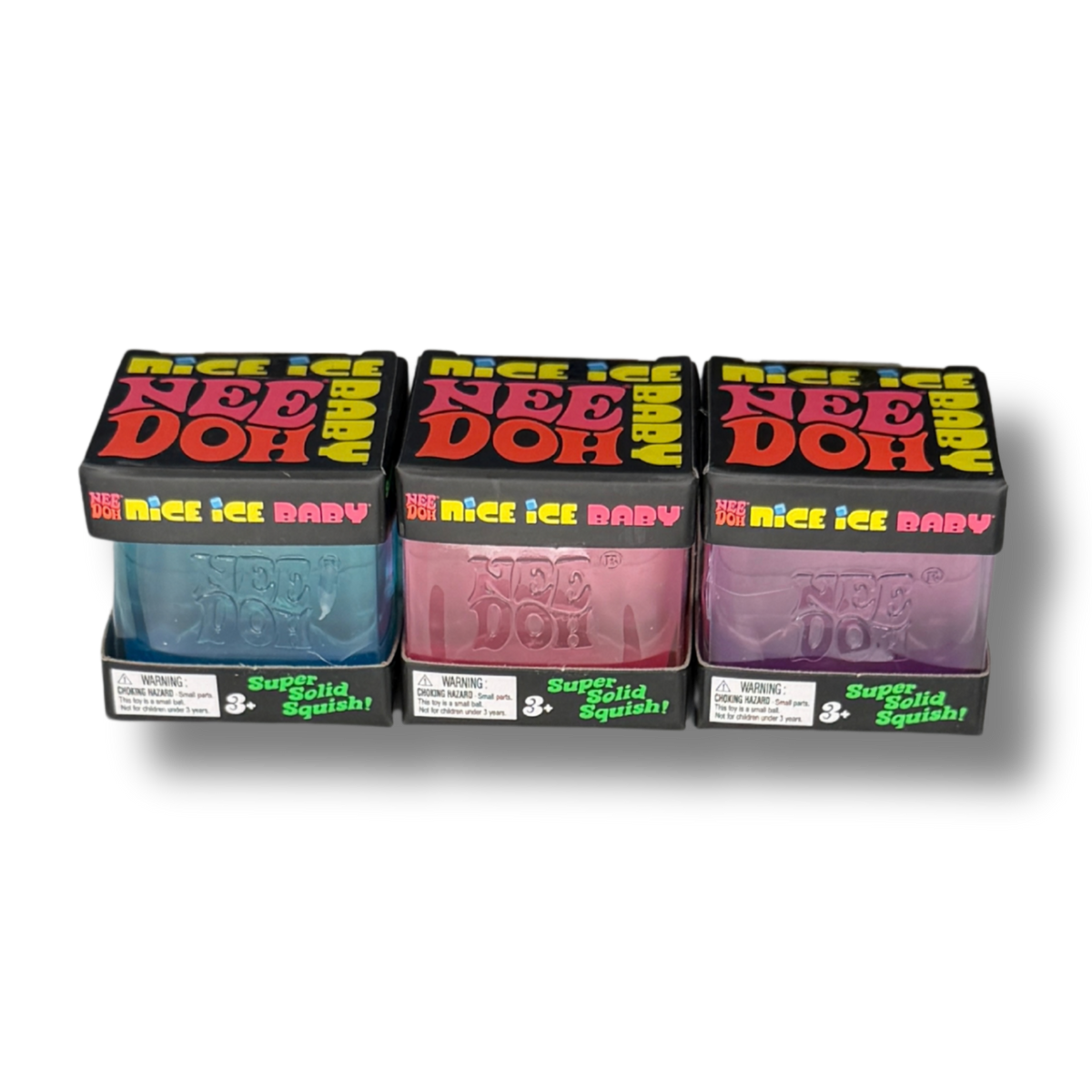 Three boxed packages of Nee Doh Super Soft Squishy toy putty in blue, pink, and purple, arranged side by side on a white background.