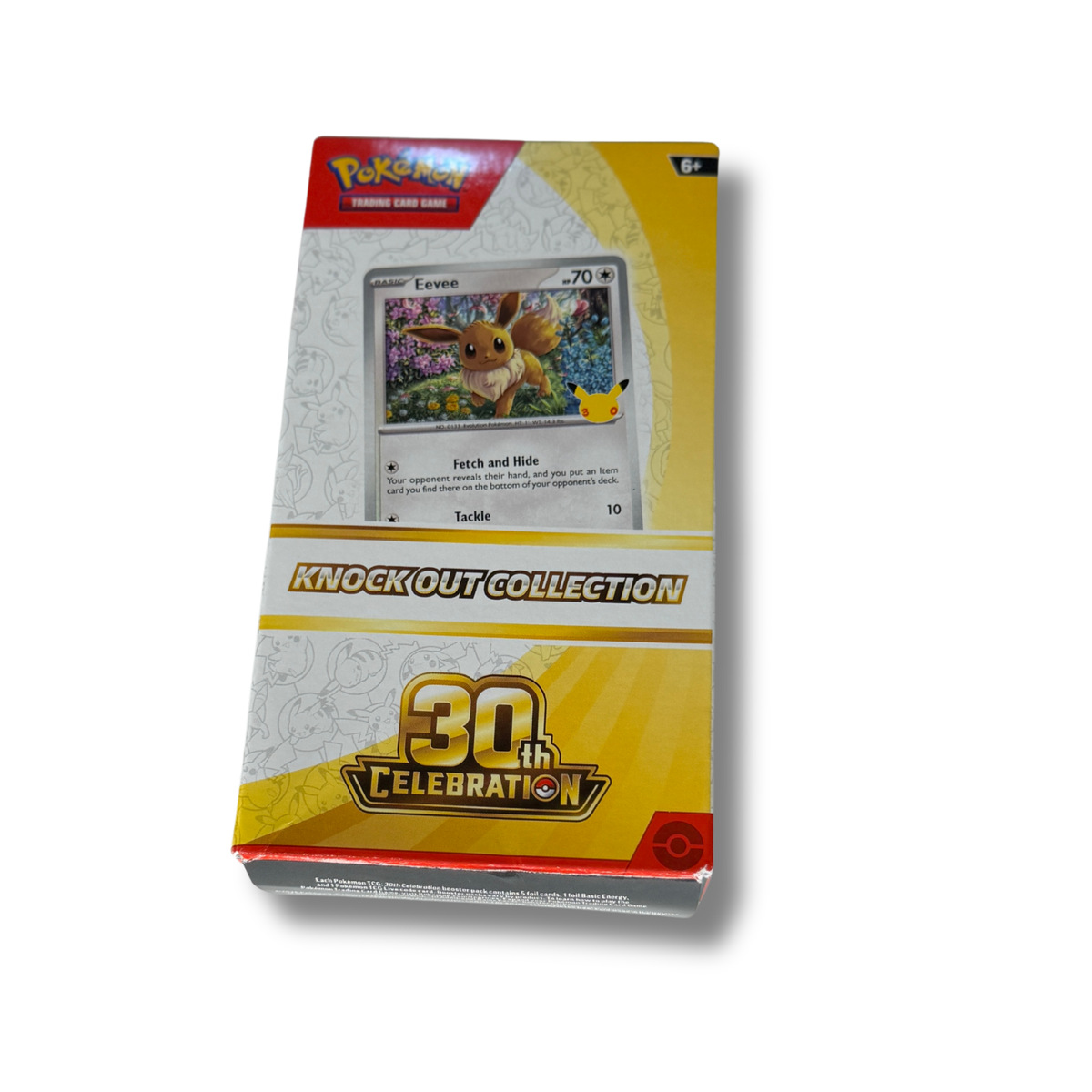 Pokémon Trading Card Game Knock Out Collection 30th Celebration booster pack box, featuring a yellow and white design with a card illustration of Eevee on the front.